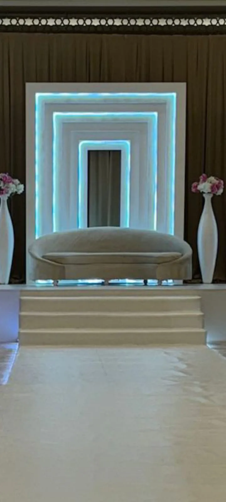 A kosha framed by layered blue light frames and white steps